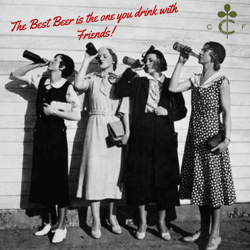 Old photo of women drinking beer from bottles